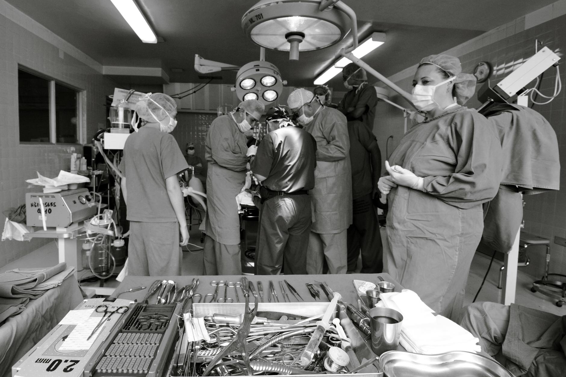 Surgeons and nurses working together during a surgical operation in an operating room.
